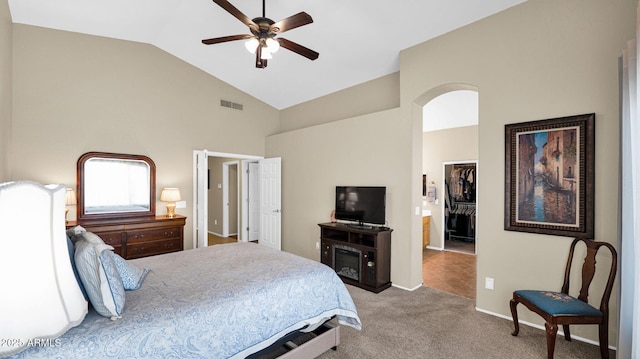 bedroom with a ceiling fan, carpet, visible vents, a spacious closet, and a closet