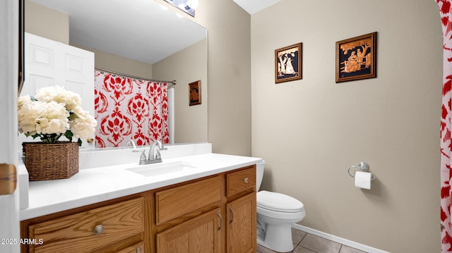 full bathroom with tile patterned floors, toilet, and vanity