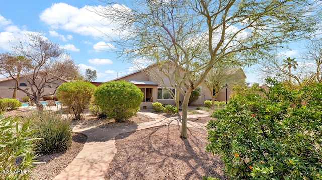 view of front of home featuring stucco siding