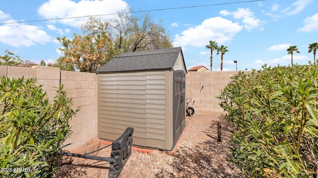 view of shed featuring a fenced backyard