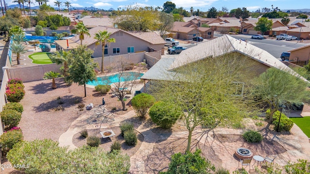 birds eye view of property with a residential view