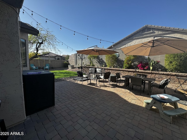 view of patio featuring fence and outdoor dining space