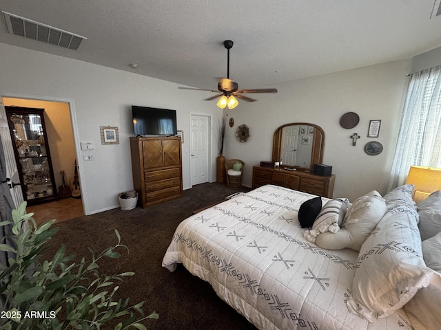 bedroom featuring visible vents, a ceiling fan, and carpet floors