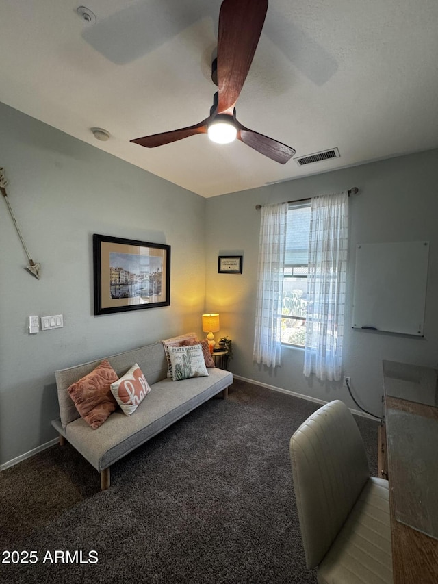 carpeted living area with baseboards, a ceiling fan, and visible vents
