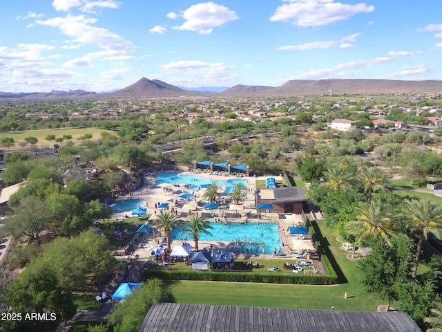 birds eye view of property with a mountain view