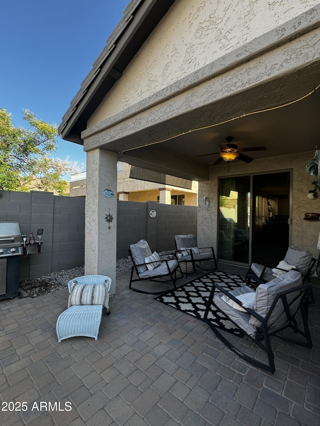 view of patio / terrace featuring a ceiling fan and a fenced backyard