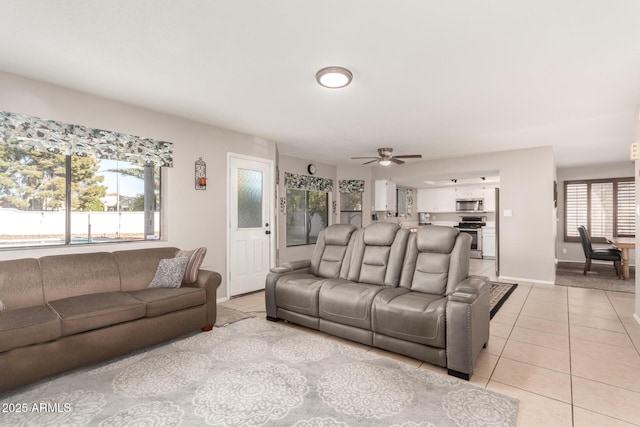 tiled living room with ceiling fan