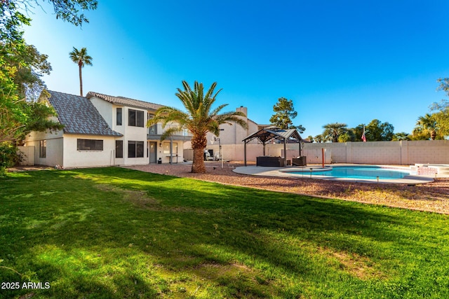 exterior space with a gazebo, a patio, and a lawn