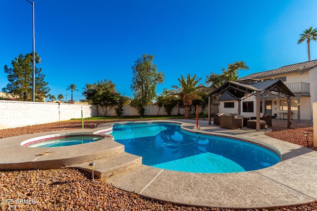 view of swimming pool featuring a gazebo, a patio area, an in ground hot tub, and an outdoor living space