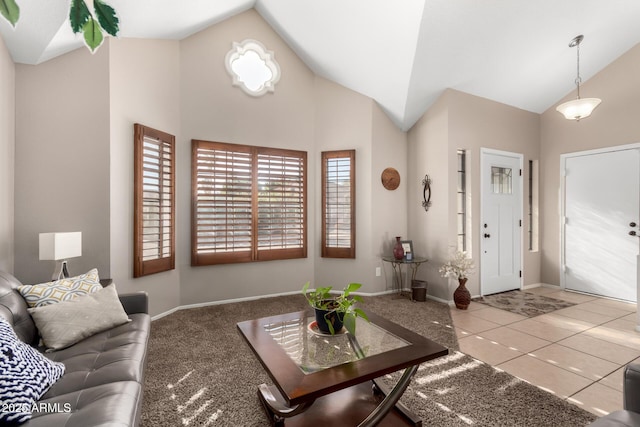 tiled living room with high vaulted ceiling