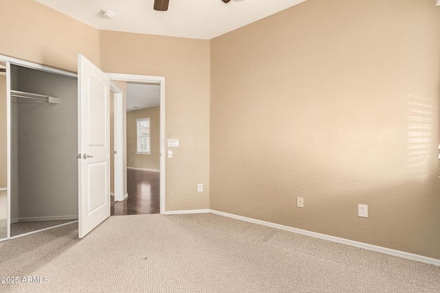 unfurnished bedroom with carpet flooring, a closet, and ceiling fan