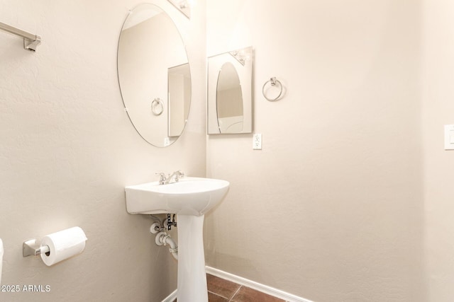 bathroom with tile patterned floors