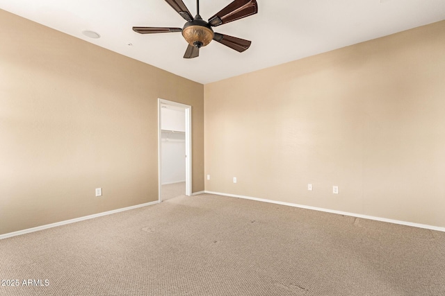 spare room featuring carpet flooring and ceiling fan