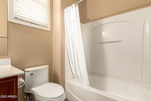 full bathroom with shower / tub combo, vanity, and toilet