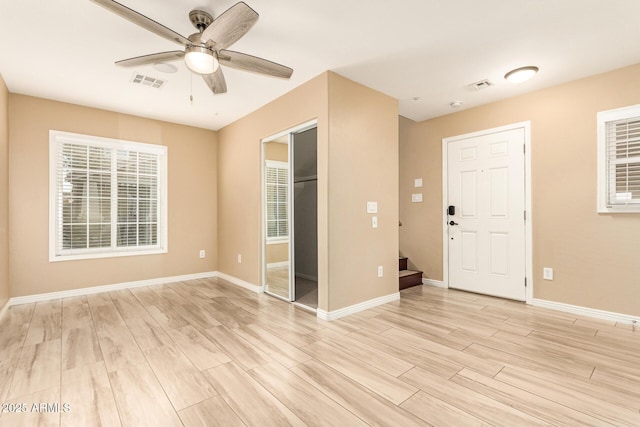 entrance foyer with light wood-type flooring and ceiling fan