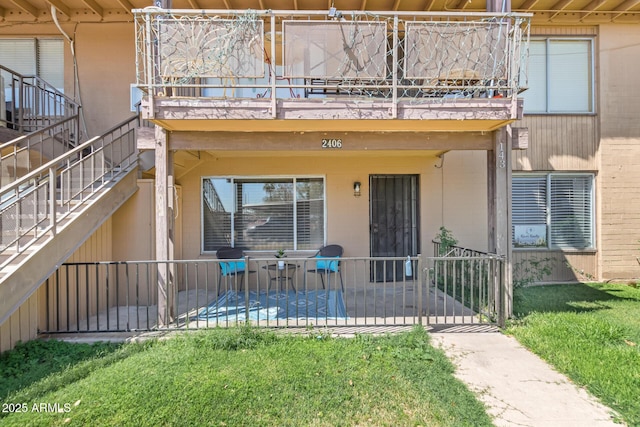 2406 W Campbell Ave Unit 143, Phoenix, AZ 85015 - doorway to property featuring a balcony and a yard