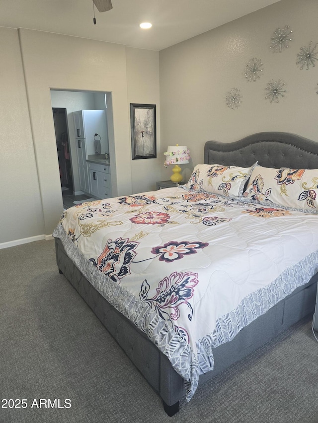 carpeted bedroom with recessed lighting, baseboards, and ensuite bathroom