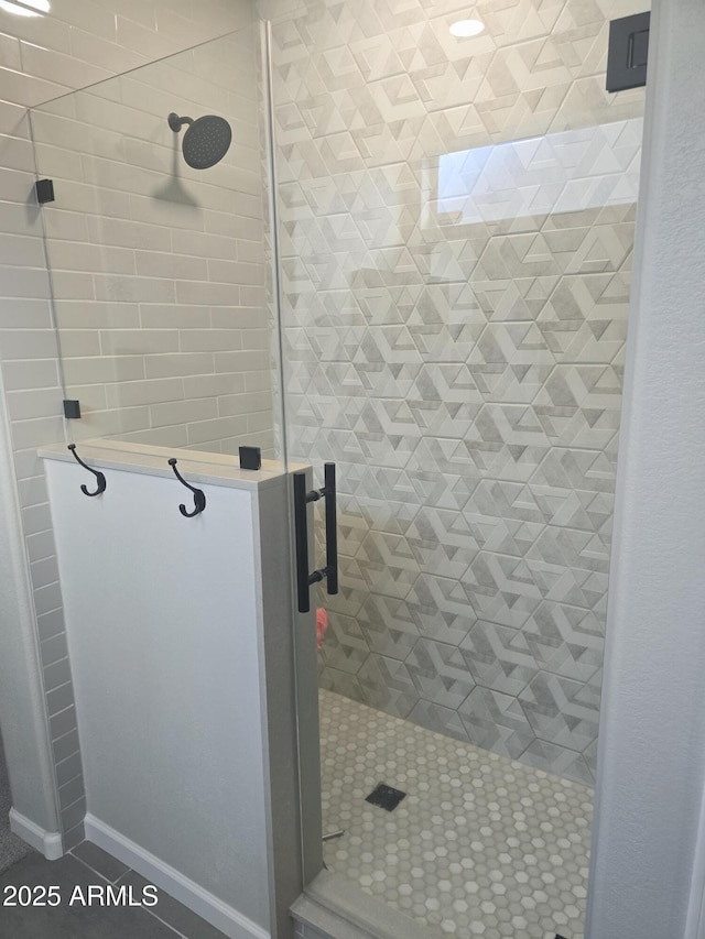 bathroom featuring a stall shower and tile patterned flooring