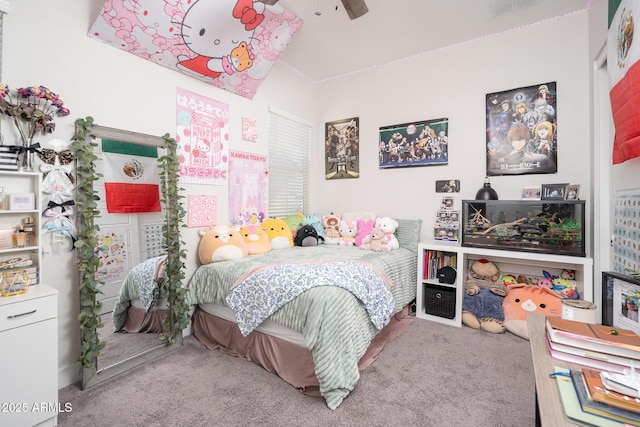 bedroom with a ceiling fan and carpet flooring