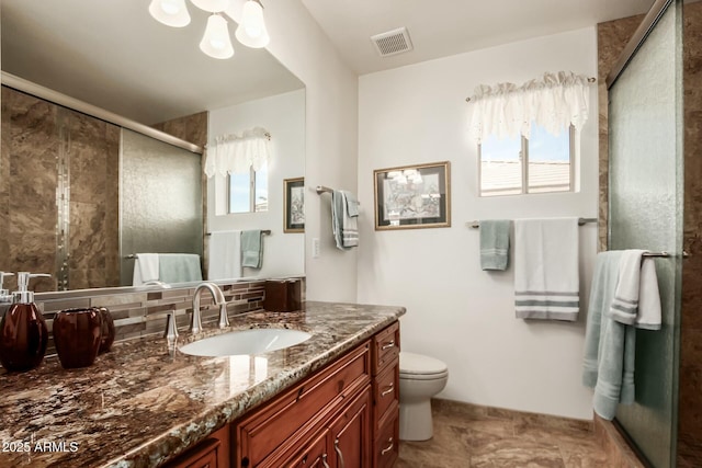 full bathroom featuring visible vents, decorative backsplash, toilet, a stall shower, and vanity