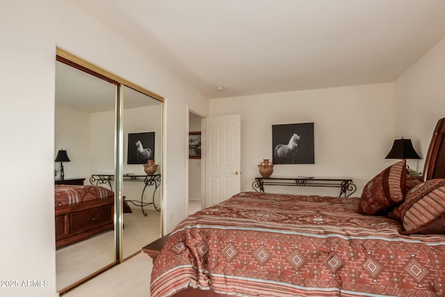 bedroom with a closet and light colored carpet