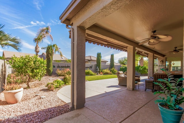 view of patio featuring ceiling fan, a fenced backyard, and an outdoor hangout area