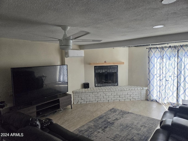 living room featuring a textured ceiling, ceiling fan, a wall mounted air conditioner, and a brick fireplace