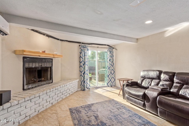 living area with a fireplace, a textured ceiling, and a wall mounted AC