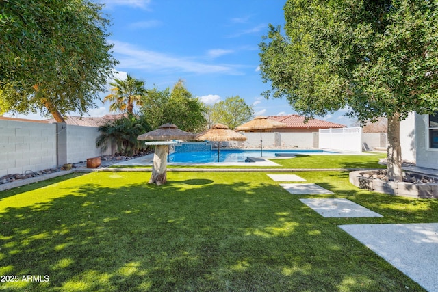 view of yard featuring a fenced backyard and a fenced in pool