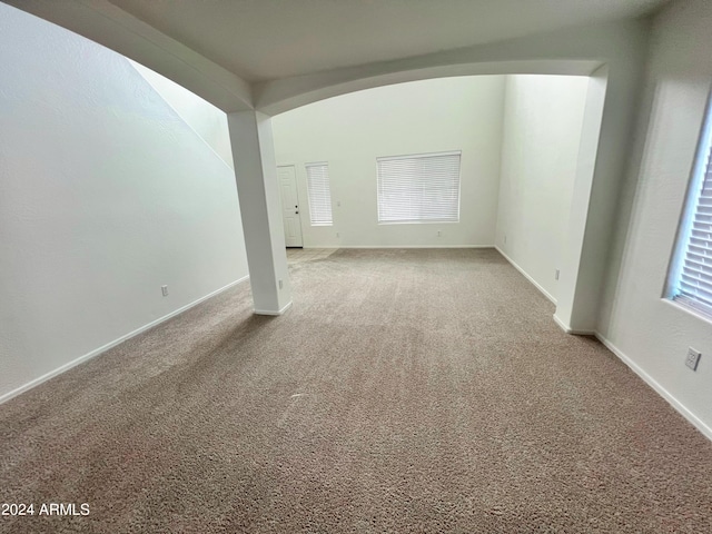 unfurnished room featuring carpet floors