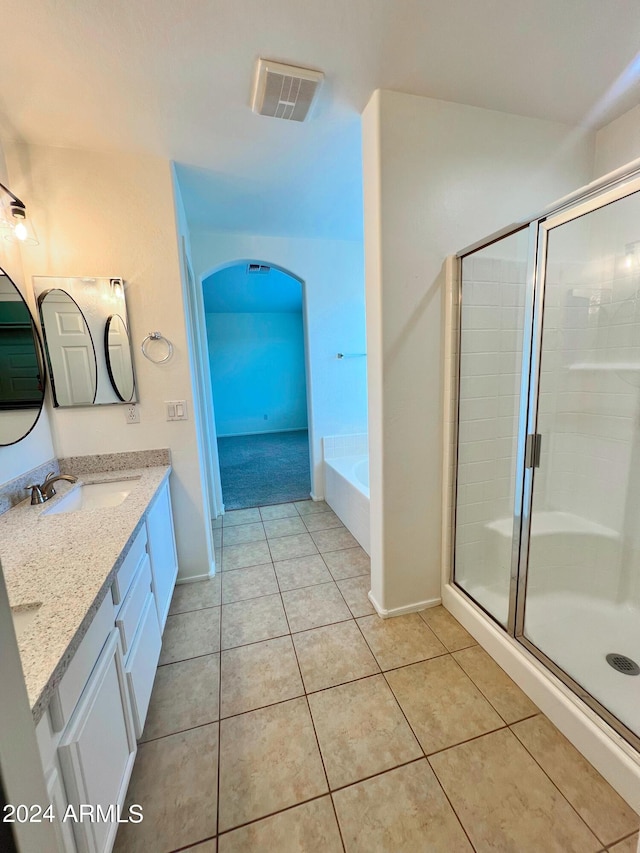 bathroom with vanity, shower with separate bathtub, and tile patterned flooring