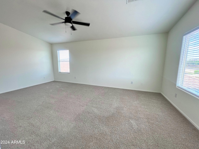 unfurnished room with ceiling fan and carpet floors