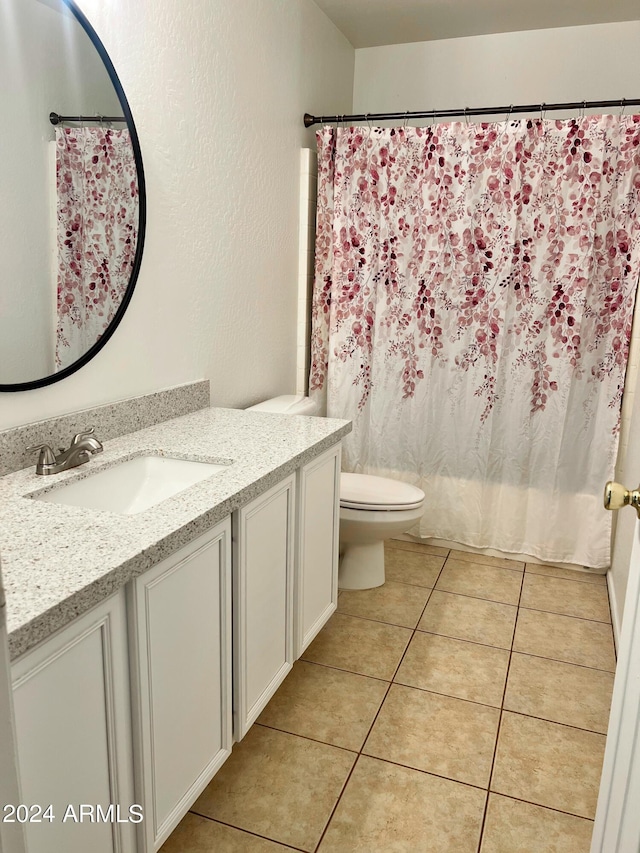 bathroom with vanity, tile patterned flooring, toilet, and a shower with shower curtain