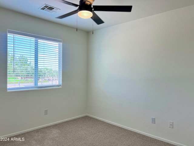 carpeted empty room with ceiling fan