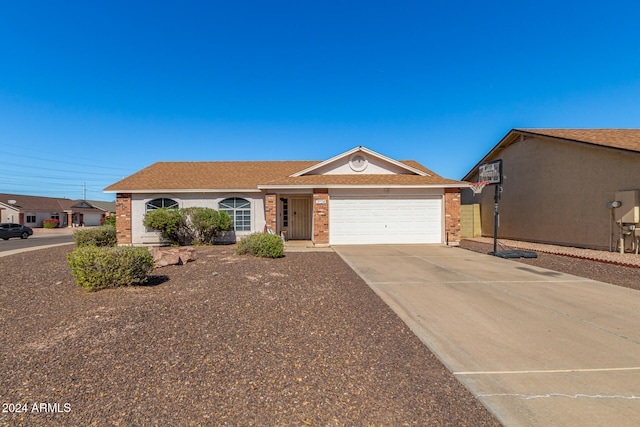 ranch-style house featuring a garage