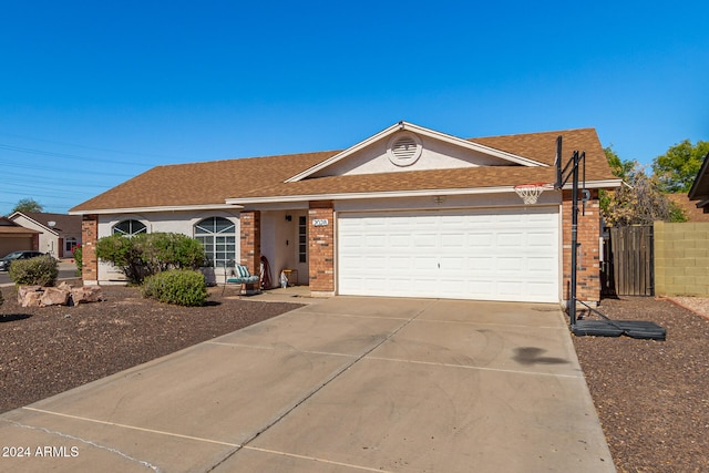 single story home featuring a garage