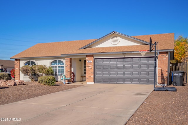 ranch-style house featuring a garage