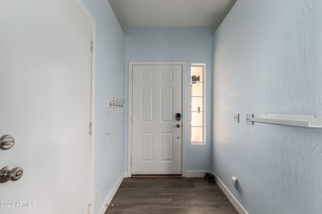 doorway with dark wood-type flooring