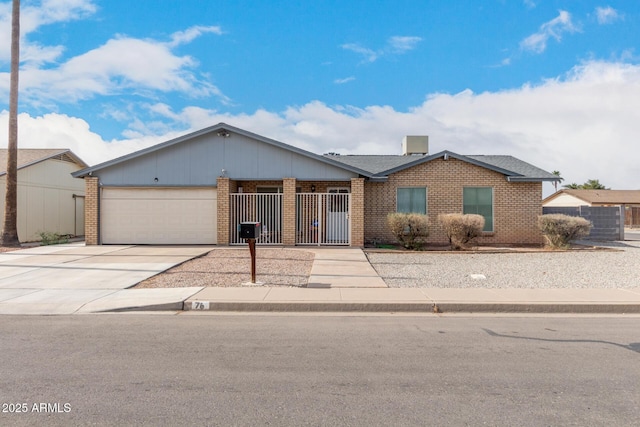 ranch-style house featuring concrete driveway, brick siding, an attached garage, and fence