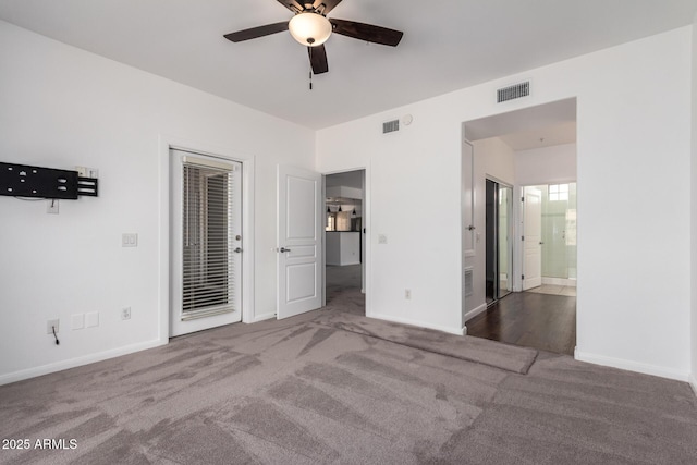 unfurnished bedroom featuring access to exterior, ensuite bath, ceiling fan, and carpet flooring