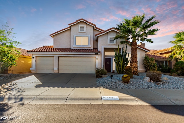 view of front of home with a garage