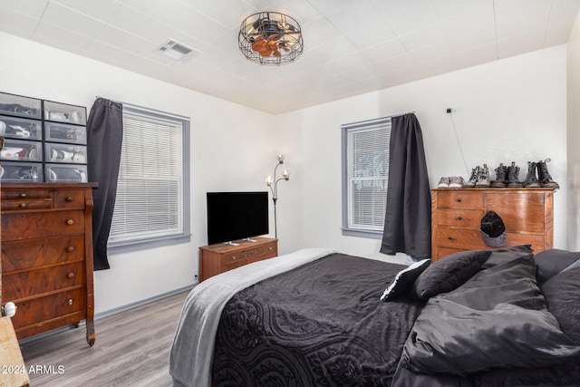 bedroom with light hardwood / wood-style floors