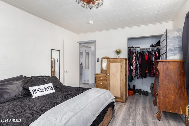 bedroom featuring hardwood / wood-style flooring and a closet