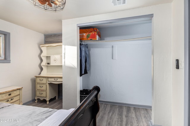 bedroom featuring dark hardwood / wood-style flooring