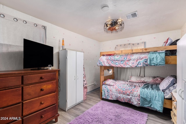 bedroom with light wood-type flooring