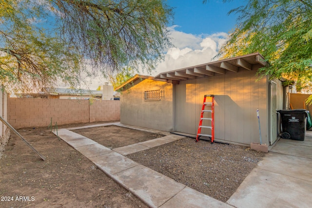 view of side of home featuring a patio area