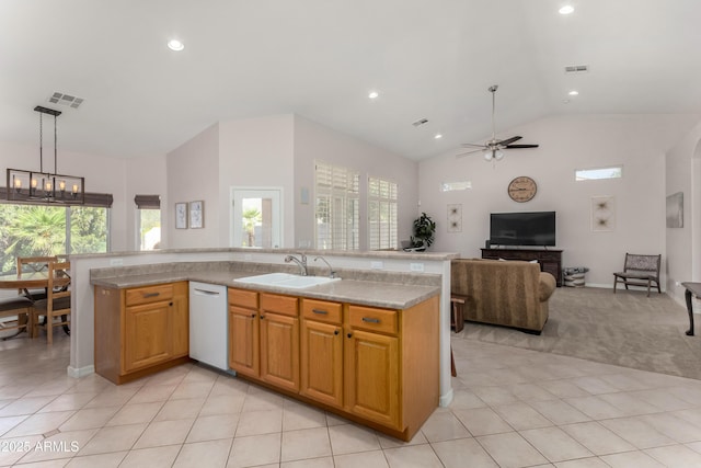 kitchen featuring light stone counters, pendant lighting, a center island with sink, visible vents, and open floor plan