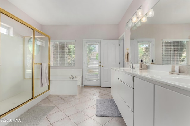 full bath featuring tile patterned flooring, a sink, a bath, double vanity, and a stall shower