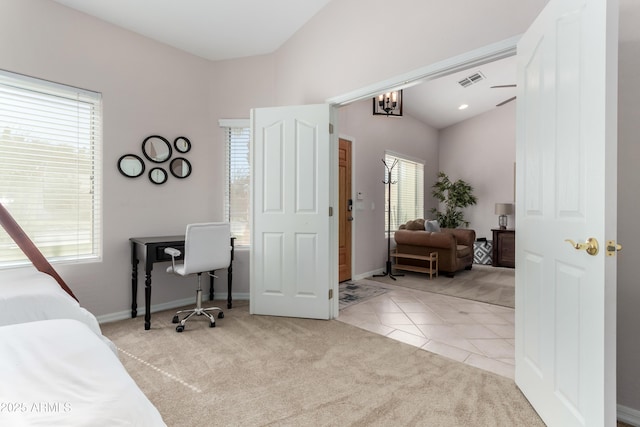 bedroom with visible vents, baseboards, light colored carpet, vaulted ceiling, and light tile patterned flooring