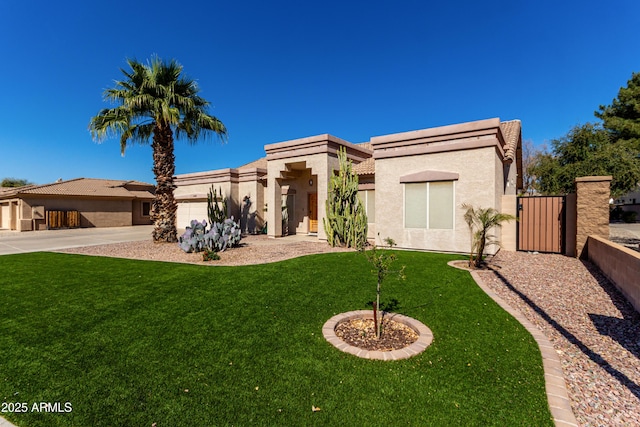 view of front of house with stucco siding, concrete driveway, an attached garage, a front yard, and fence